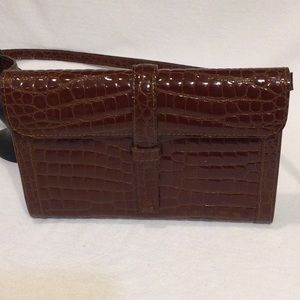 Genuine leather crocodile print purse made in Italy.